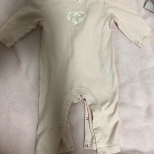 Pink and white Gucci Onesie.
